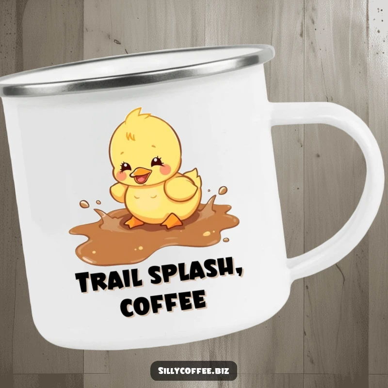 Funny camping mug showing a kawaii duckling happily splashing in a spilled coffee puddle, ready for outdoor enjoyment.
